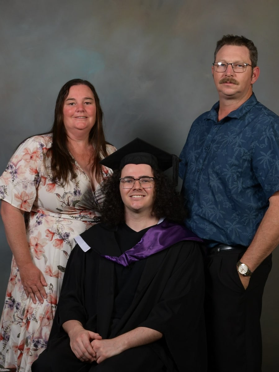Graduation photo with my parents after the ceremony